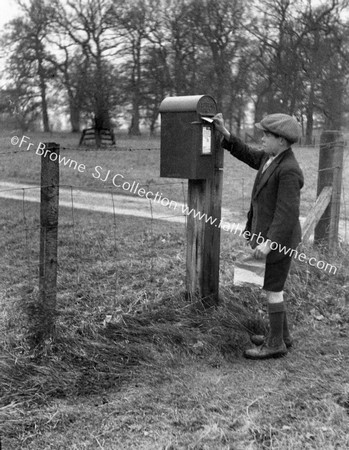 BOY AT LETTERBOX